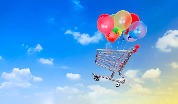 Carro mercado con globos en el cielo, analogía de incremento de precios e inflación